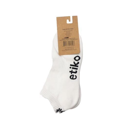 Etiko's fairtrade certified white organic cotton ankle socks with a black etiko logo